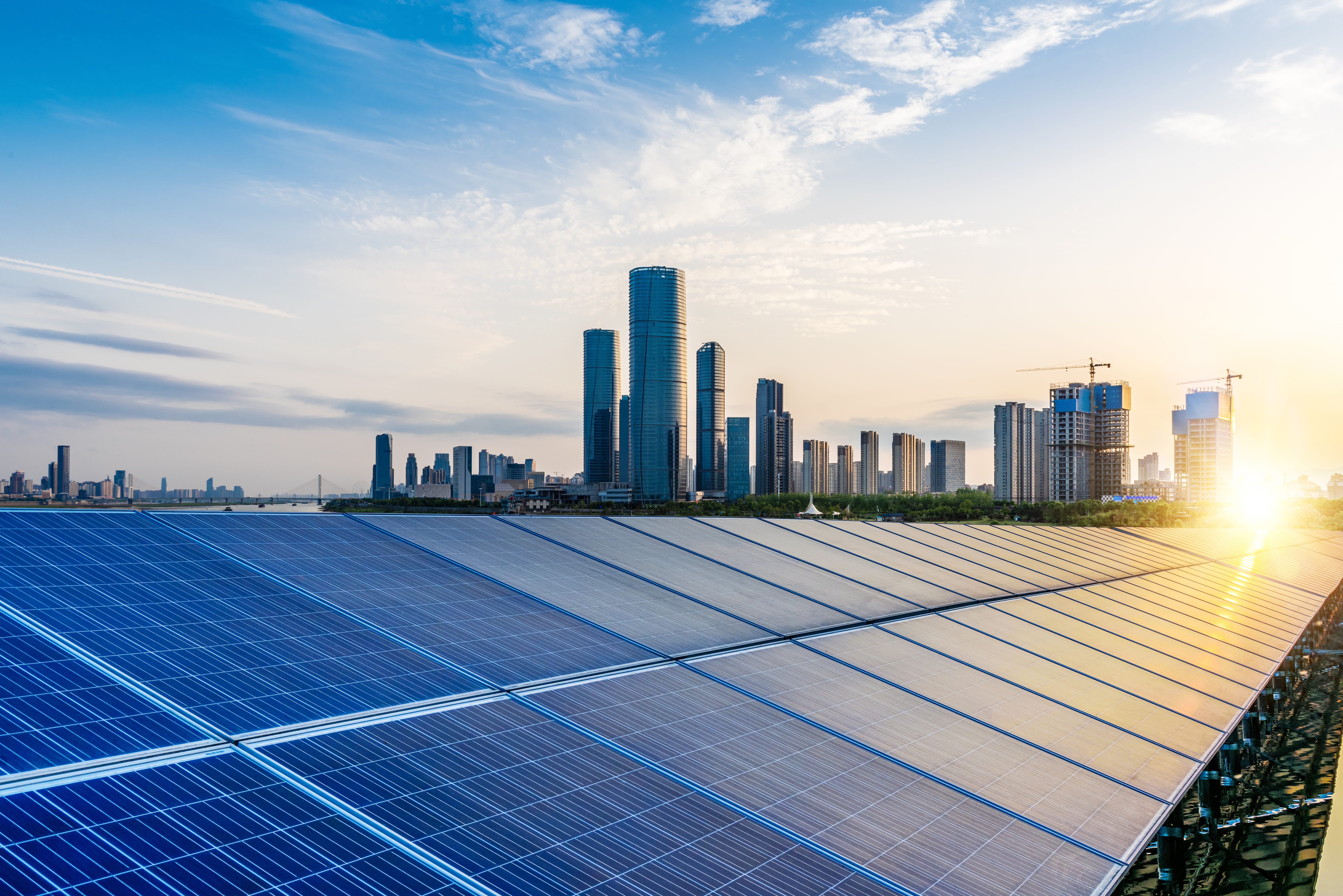 Solar panels with a city skyline